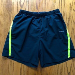 Saucony - mens black running shorts with neon yellow trim - size M